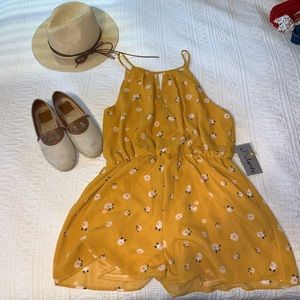 Yellow summer romper with cute flowers